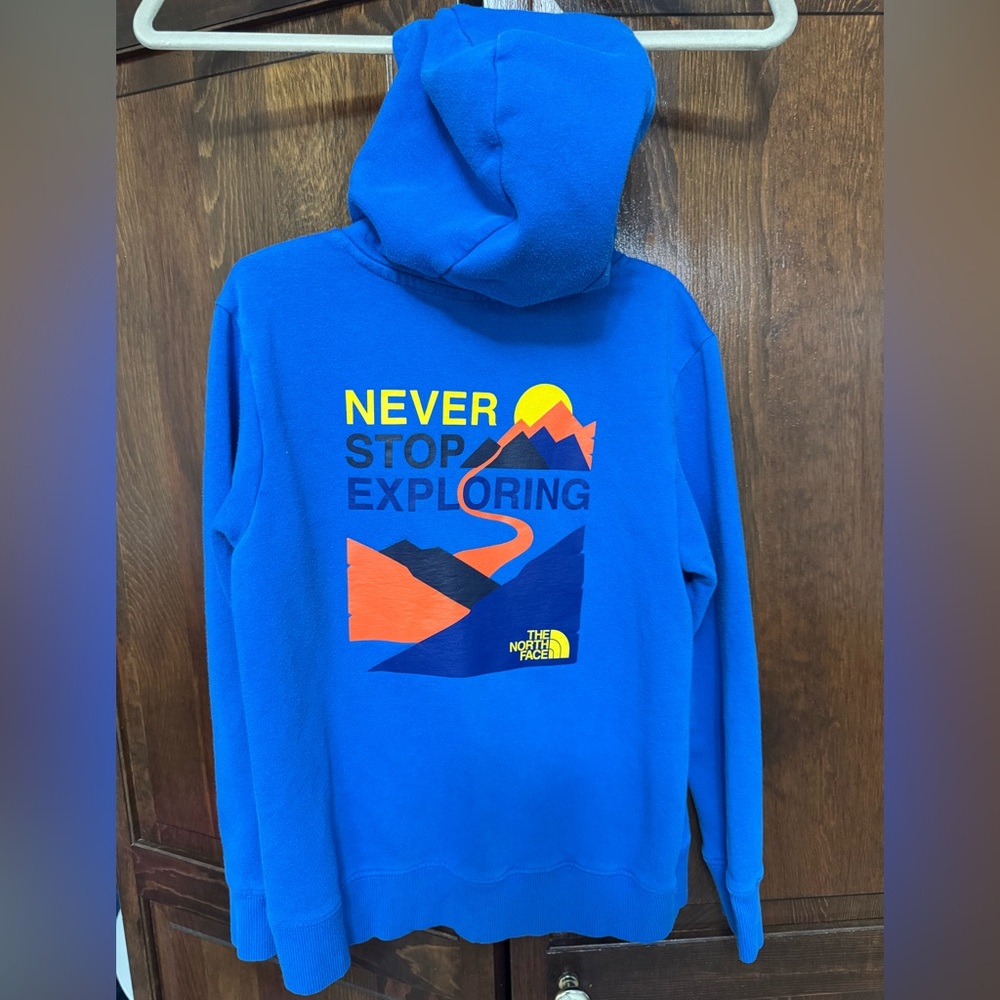 The North Face Blue Kids Hoodie with Mountain Graphic